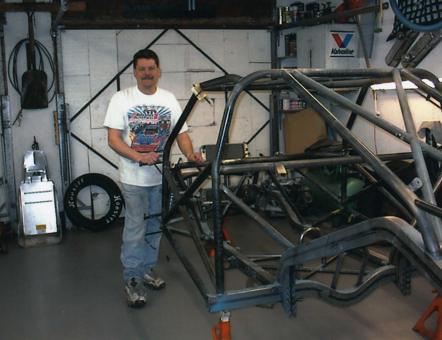 Keith with the frame of his 69 Dodge Dart Keith with the frame of his 69 Dodge Dart